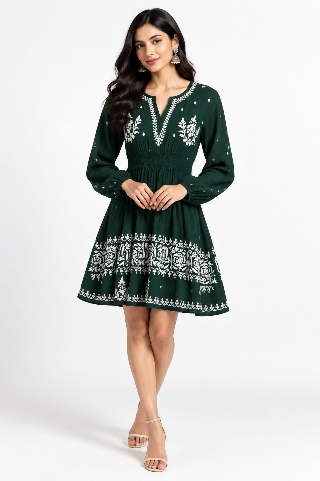 A bottle green short dress with long-sleeve dress with white floral embroidery and white dot details.