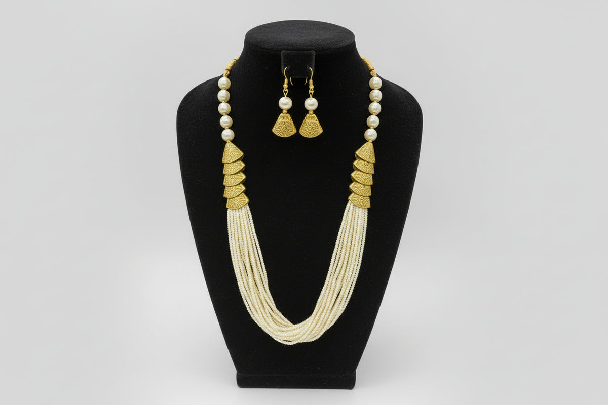 off White mini beaded mala with gold accents and matching earrings by famaza couture 