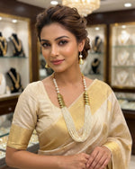 off White mini beaded mala with gold accents and matching earrings by famaza couture .