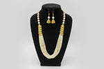 off White mini beaded mala with gold accents and matching earrings by famaza couture 