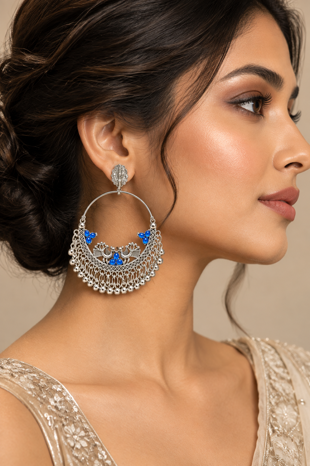 Blue worn on model: Model wearing silver-tone peacock chandbali earrings with blue accents and dangling ghungroo fringe
