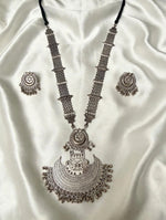 Oxidised silver Afghan Rani Haar Y-shaped necklace set — large crescent pendant, stud mini jhumka earrings, black dori cord — pendant 8.5cm drop x 8cm wide, chain 13cm drop, 25g — on cream silk.