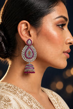 oxidised tone tear drop earrings with hot pink nano stones and hangings are wornby model