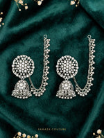 Pakeezah Moonlight silver-tone jhumka earrings with beaded Sahara chains on dark green fabric