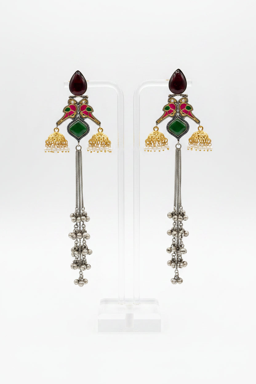 parrot figures golden and black long Kashmiri earrings with mini jhumkas on both sides and green stone in the centre. 