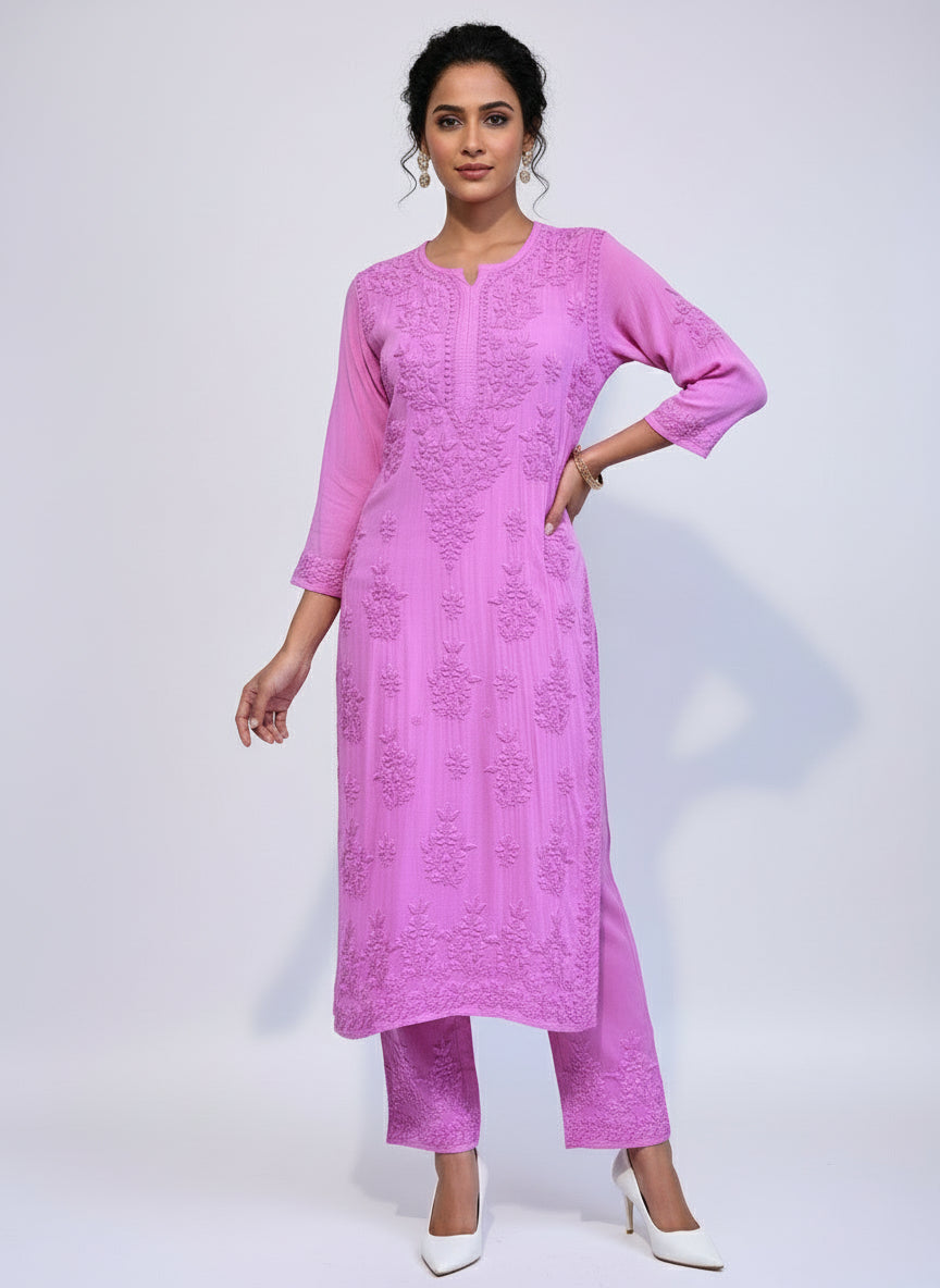 pink colour modal fabric tone to tone hand embroidered kurti and trousers. Kurti is 46 inches long