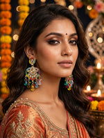 Model wearing heart-shaped multicolour chandelier earrings with faux pearls and colourful teardrop beads.