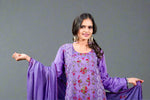 Pakistani embroidered suit set with close-up of floral embroidery details
