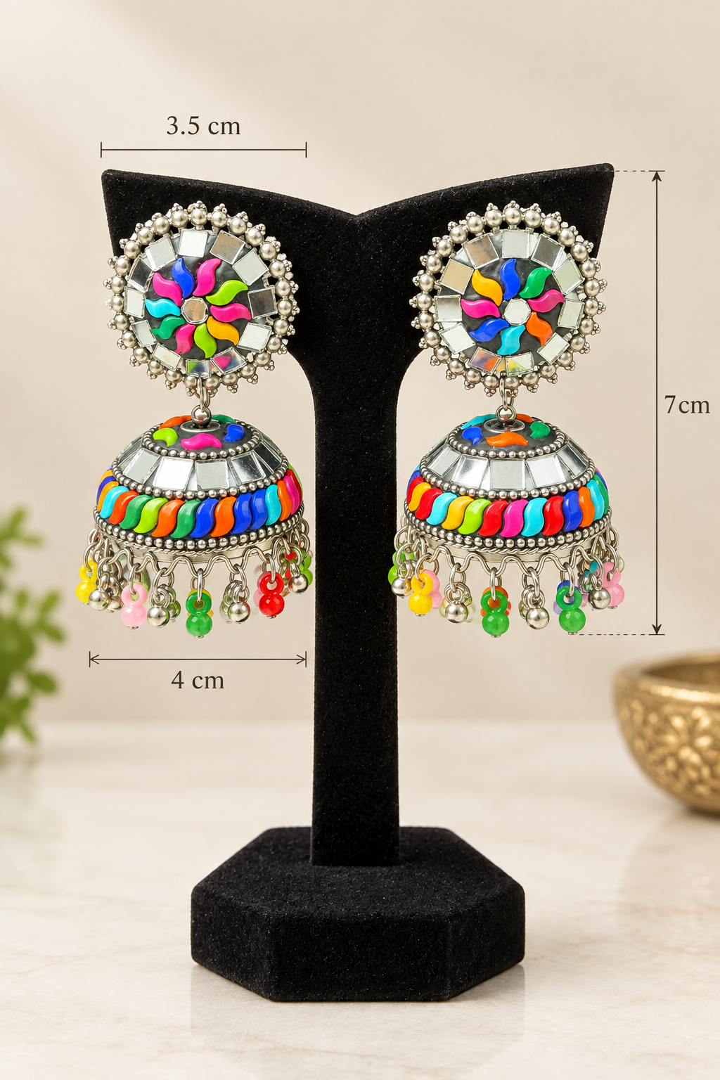A pair of Famaza Couture multi-coloured plastic and mirror work oxidised jhumka earrings dimensions are showing in this image. 