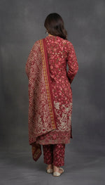 rear view of red colour Soft khaddar material detail of traditional Pakistani embroidered suit