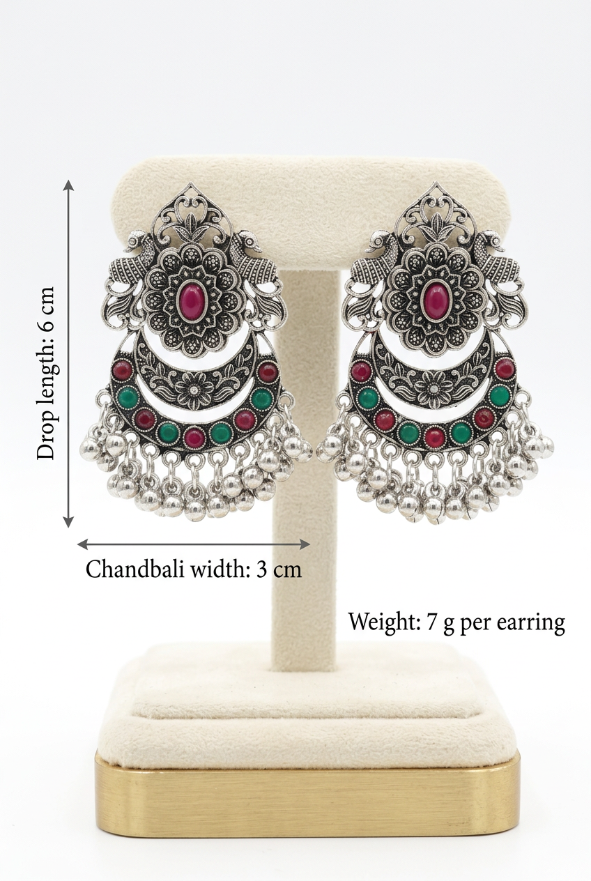 Regal Bloom red and green chandbali earrings on a cream stand, labelled with a 6 cm drop length, 3 cm chandbali width and 7 g weight per earring