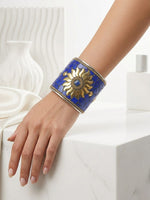 Close-up view of the intricate hand-set royal blue sunburst mosaic stone centerpiece on the artisan heritage cuff
