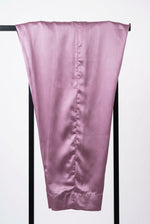 Plain lavender trousers from the Shan-e-Sheeba three-piece suit draped over a black display stand
