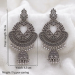 Silver-tone elephant motif chandbali jhumka earrings with floral tops and dangling beads on white fabric