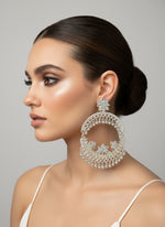 silver round bali earrings with small bells on inner and outer circle by famaza couture 