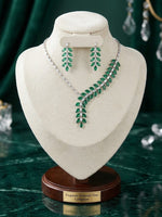 The Empress Emerald American Diamond Marquise necklace and earrings set by Famaza Couture, featuring brilliant rhodium-plated emerald green stone work.