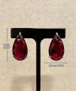 Ruby red teardrop crystal earrings with measurements showing 2 cm length and 1.5 cm width.