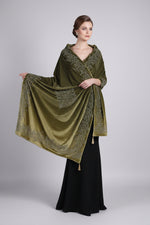 Folded bottle green velvet scarf showing bird and floral stone-work motifs.