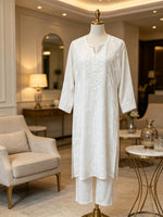 Tailored white rayon trousers featuring premium hand-crafted Chikankari embroidery running down the hemline, part of a 2pc co-ord set.