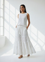 white cotton flared trousers with chikankari embroidery work and with pockets on both sides of the belt