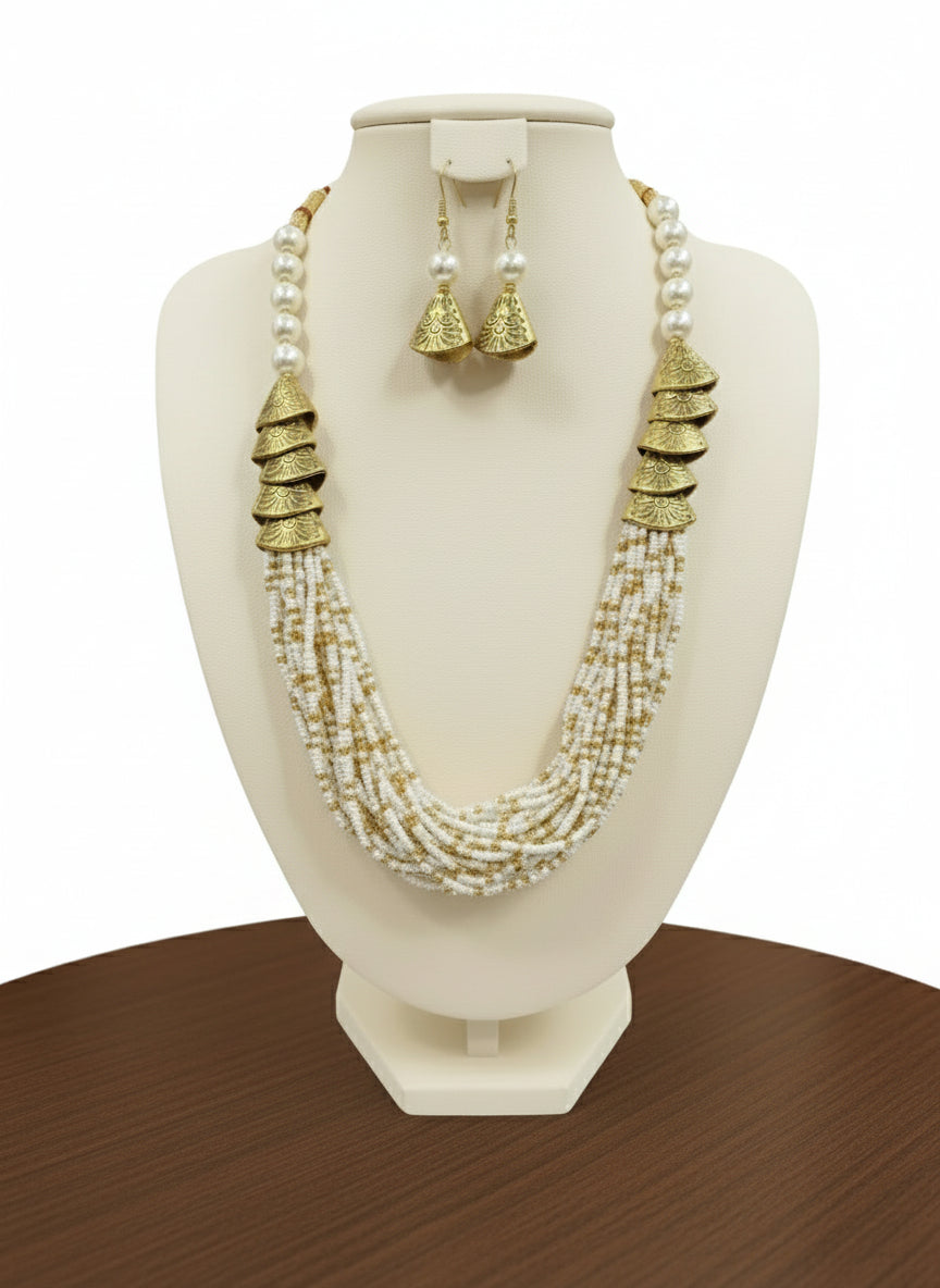 white with golden braided mala jewellery set with gold accents and matching earrings by famaza couture 