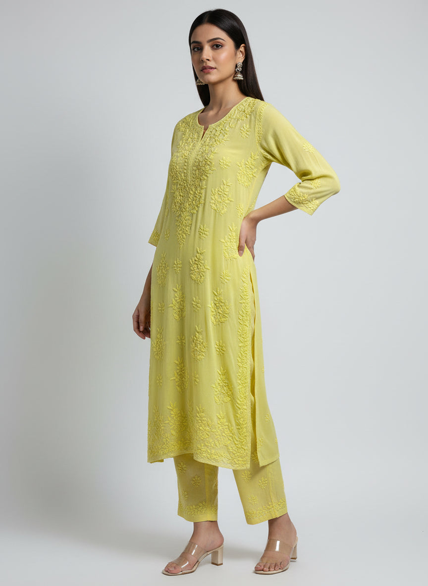 yellow colour modal fabric tone to tone hand embroidered kurti and trousers. Kurti is 46 inches long
