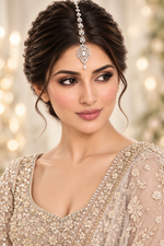Model wearing Zara silver-tone American diamond maang tikka with an ornate pendant and teardrop accent